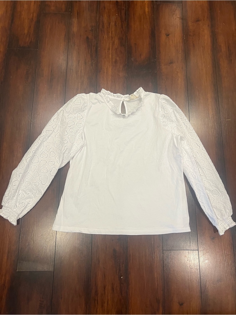 White Eyelet Sleeve Ruffle Neck Blouse by Biden